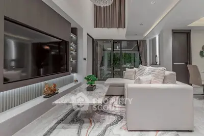 Luxurious modern living room with elegant decor and spacious seating area.