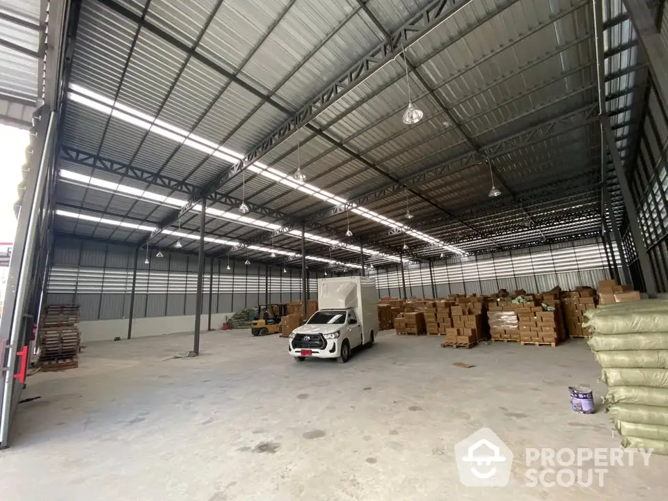 Spacious warehouse interior with high ceilings and ample storage space