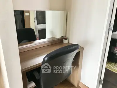 Cozy study nook with desk, chair, and mirror in modern apartment