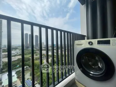 High-rise balcony with city view and washing machine, perfect for urban living.