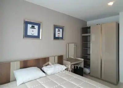 Modern bedroom with stylish decor and ample storage space