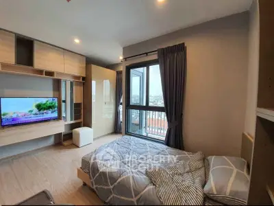 Modern bedroom with large window and stylish decor in urban apartment