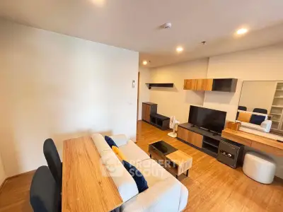 Modern living room with stylish wooden furniture and cozy seating area.