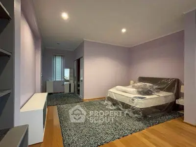 Spacious bedroom with modern decor and natural light