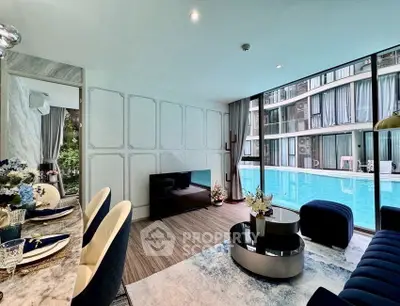 Luxurious living room with pool view, elegant decor, and modern furnishings in a high-end apartment.