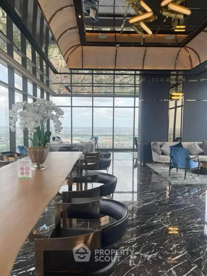 Luxurious high-rise living room with panoramic city views and modern decor.