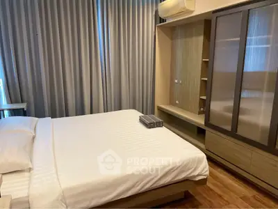 Modern bedroom with sleek design and ample storage space