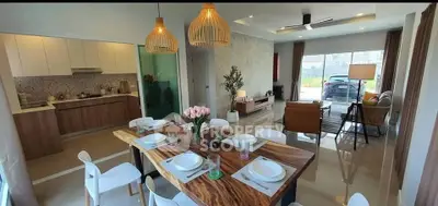Spacious open-plan living and dining area with modern kitchen and elegant decor