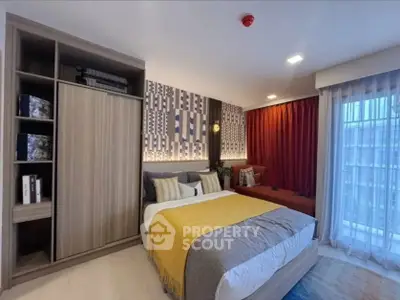 Modern bedroom with stylish decor and large window view