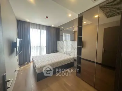 Modern bedroom with large window and sleek design