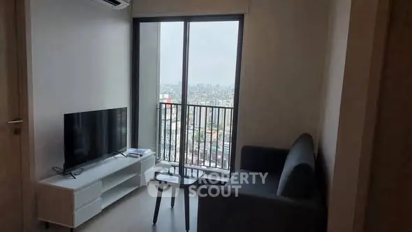 Modern living room with city view, sleek furniture, and large window.