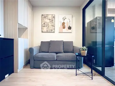 Modern living room with cozy gray sofa and stylish decor