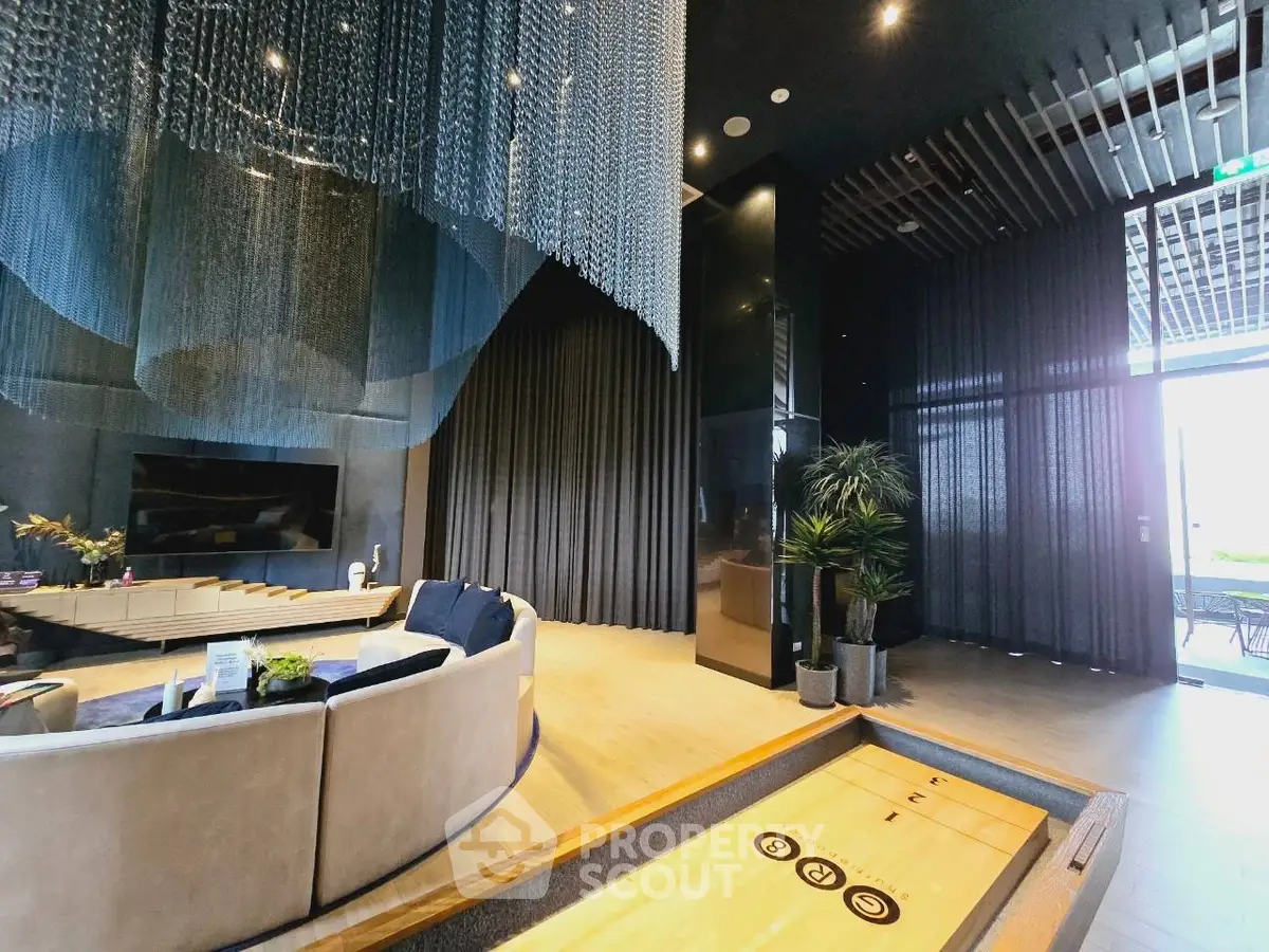 Luxurious modern living room with elegant decor and unique lighting features.