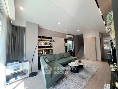 Modern living room with stylish green sofa and elegant decor