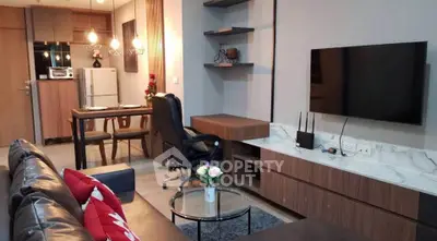Modern living room with stylish decor and open kitchen layout
