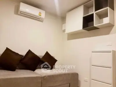 Modern living room with sleek air conditioning and stylish storage solutions.