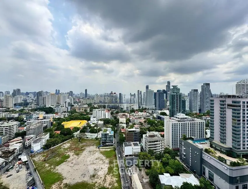 Stunning cityscape view from high-rise building with cloudy sky