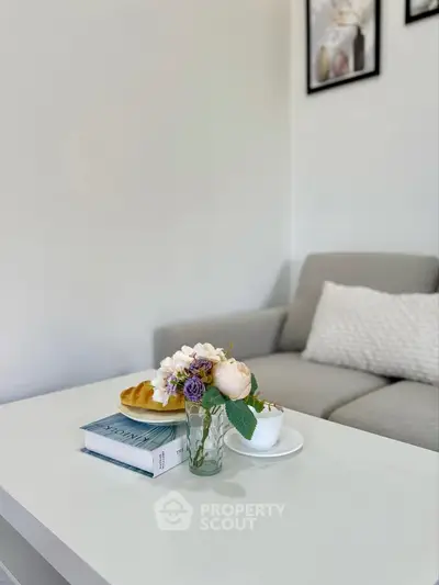 Stylish living room with modern decor and cozy sofa, perfect for relaxation.