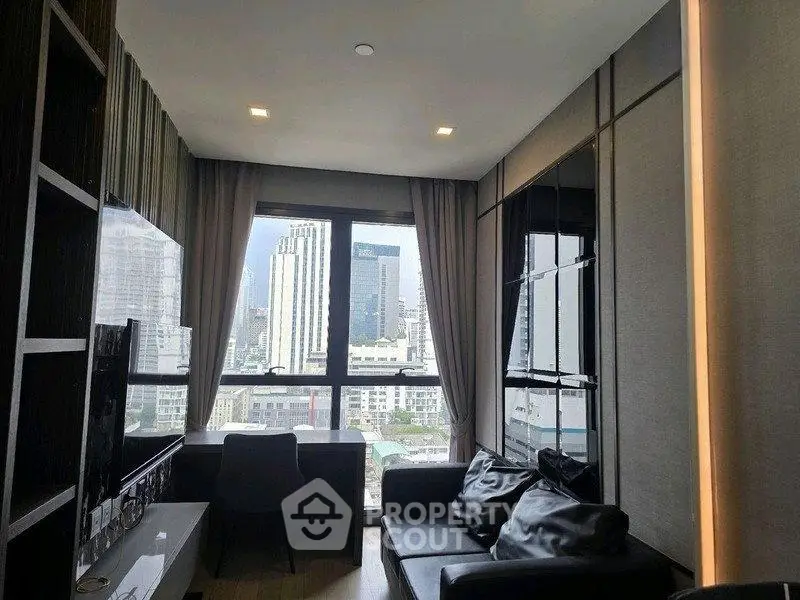 Modern living room with city view, sleek furniture, and large windows in a high-rise apartment.