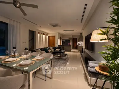 Luxurious open-plan living and dining area with modern decor and ambient lighting.