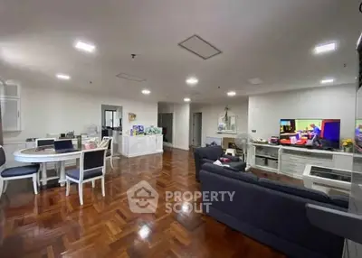 Spacious living room with elegant wooden flooring and modern furniture