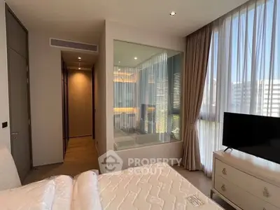 Luxurious bedroom with large windows and modern decor