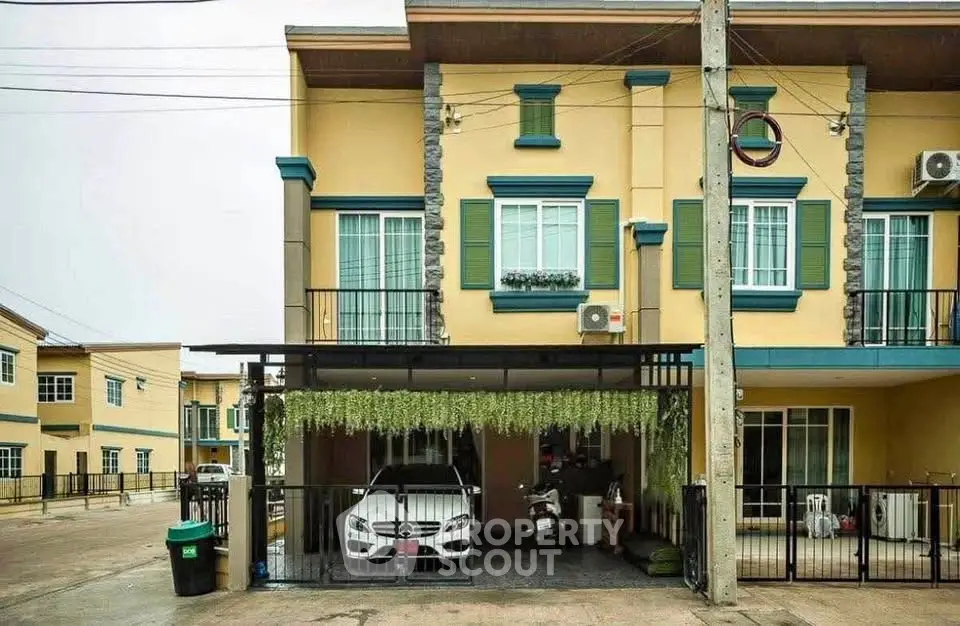 Charming townhouse with balcony and garage in a serene neighborhood, perfect for modern living.