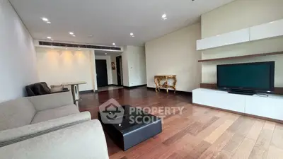 Spacious modern living room with hardwood floors and elegant furniture