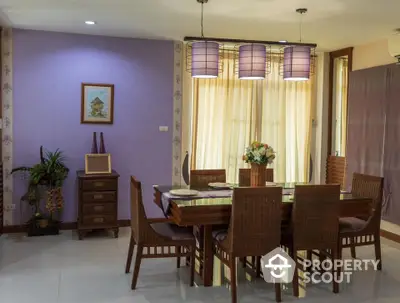 Elegant dining room with wicker chairs and modern lighting