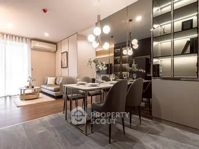 Modern dining and living area with elegant lighting and stylish decor