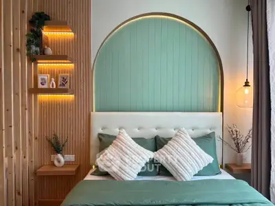 Stylish bedroom with modern decor and ambient lighting, featuring a cozy bed and elegant wooden accents.