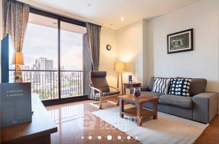 Spacious living room with city view, modern furniture, and large windows in a high-rise apartment.