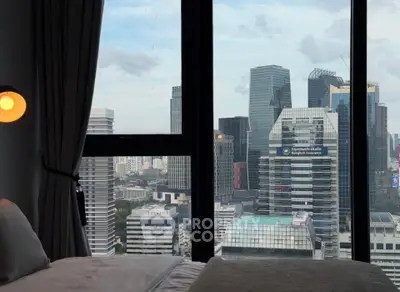Luxurious bedroom with stunning city skyline view through large windows, perfect for urban living.