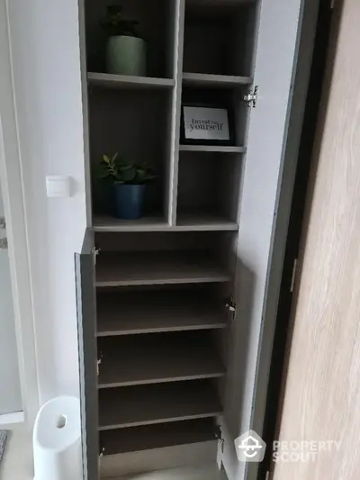 Modern storage cabinet with multiple shelves and decorative plants