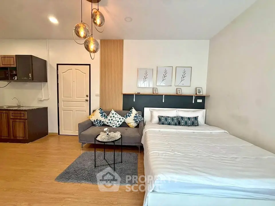 Modern studio apartment with cozy living area and stylish decor