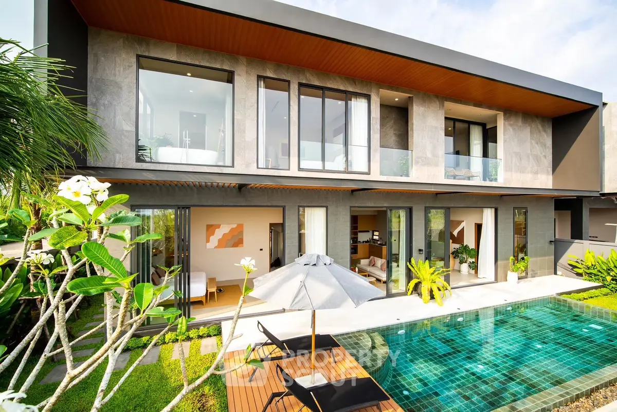 Luxurious modern villa with pool and lush garden, perfect for serene living.