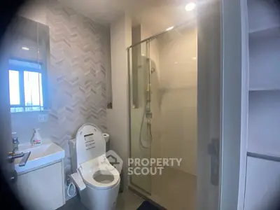 Modern bathroom with glass shower and stylish tile design