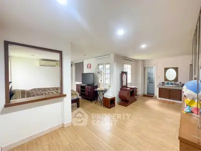 Spacious open-plan living area with modern decor and natural light