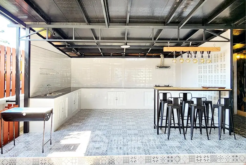 Modern outdoor kitchen with sleek design and stylish bar seating