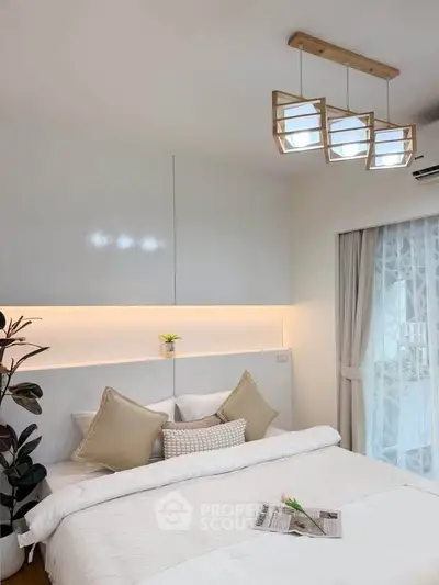 Modern bedroom with elegant lighting and cozy decor, featuring a stylish bed and soft ambient lighting.
