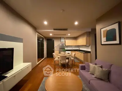 Spacious modern living room with open kitchen and elegant decor