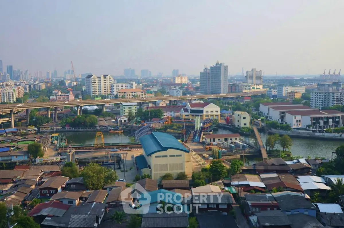 Stunning cityscape view showcasing urban development and serene waterway.