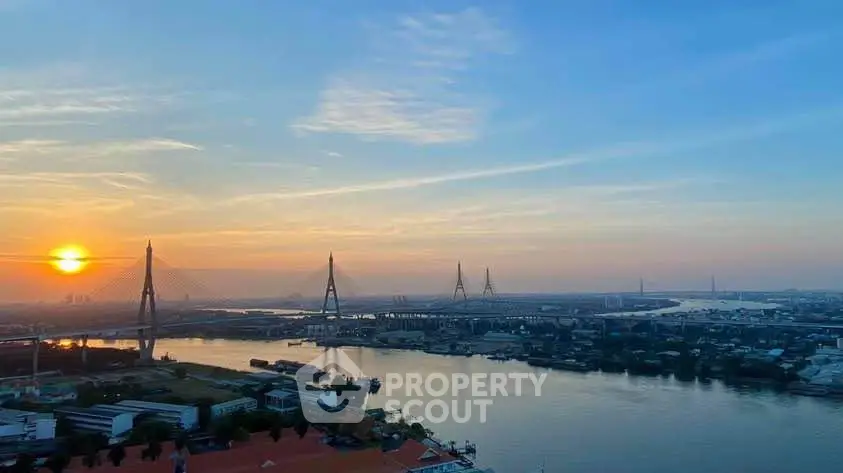 Stunning river view with iconic bridge at sunset, perfect for luxury real estate listings.