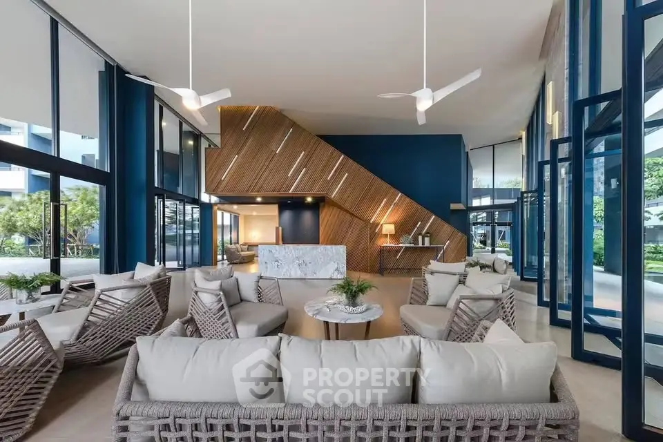 Luxurious modern living room with stylish decor and expansive windows