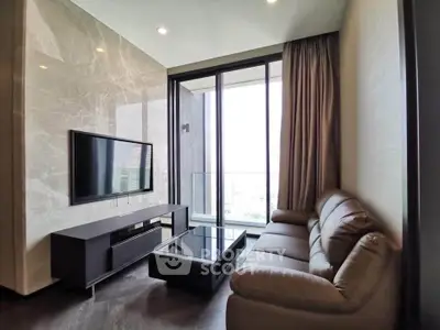 Luxurious modern living room with sleek furniture and floor-to-ceiling windows offering stunning views.