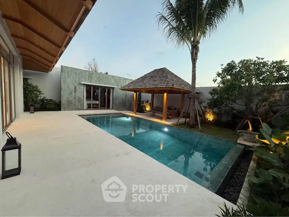 Luxurious villa with private pool and tropical garden, perfect for serene living.