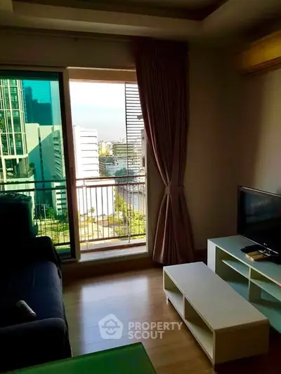 Modern living room with balcony view in high-rise apartment