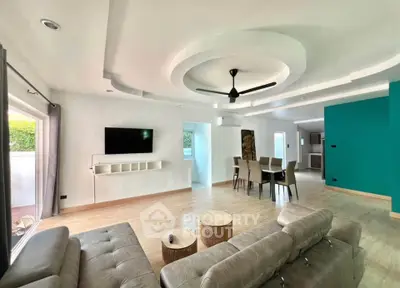 Spacious modern living room with stylish ceiling design and open layout