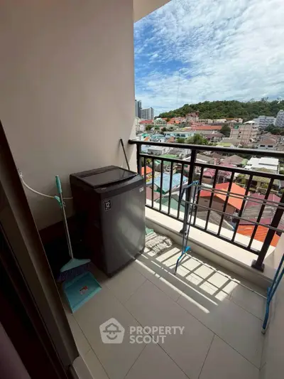 Charming balcony with scenic city view, perfect for relaxation and enjoying the outdoors.