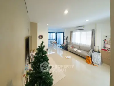 Spacious living room with modern decor and exercise equipment, perfect for relaxation and fitness.